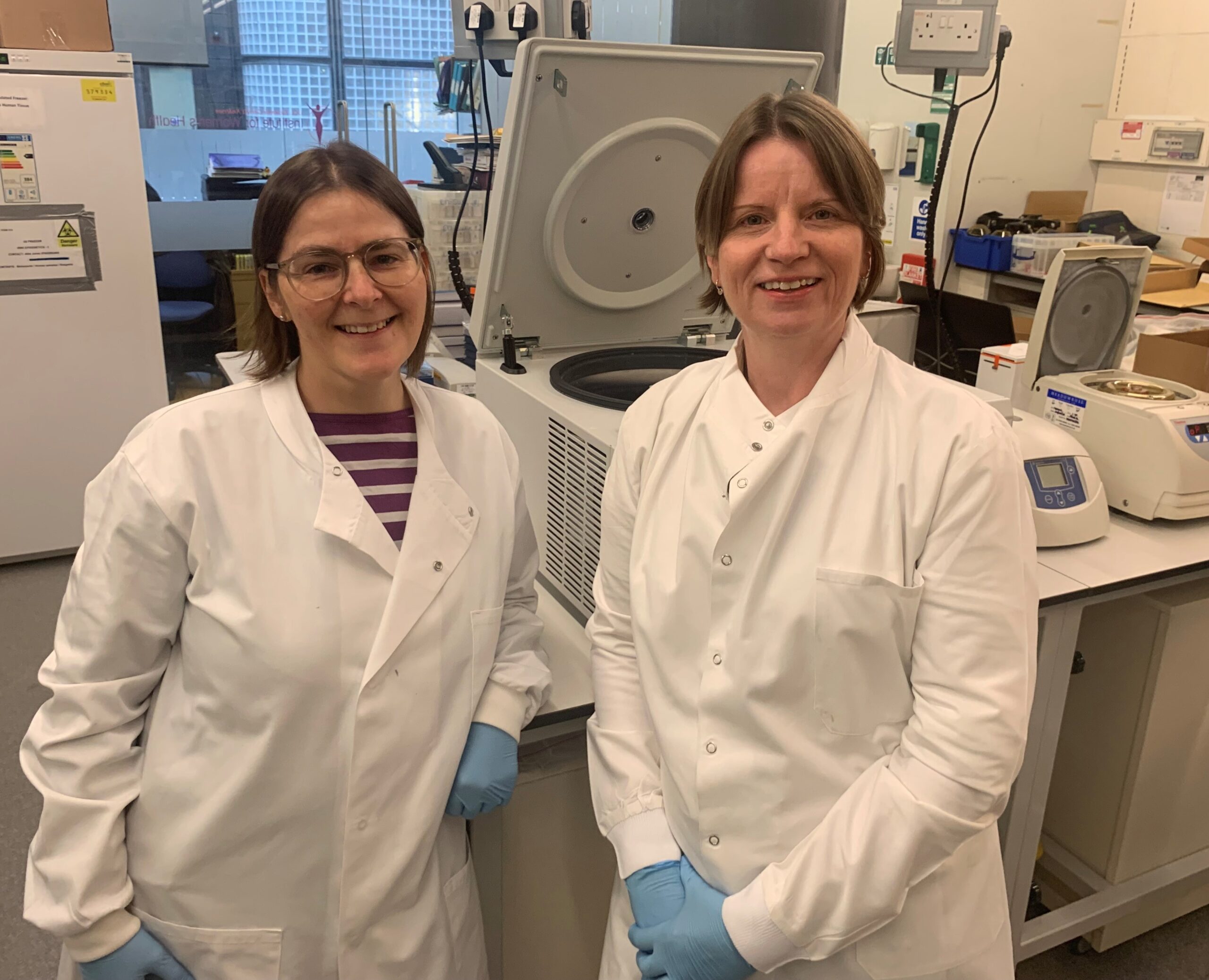 Two researchers smiling