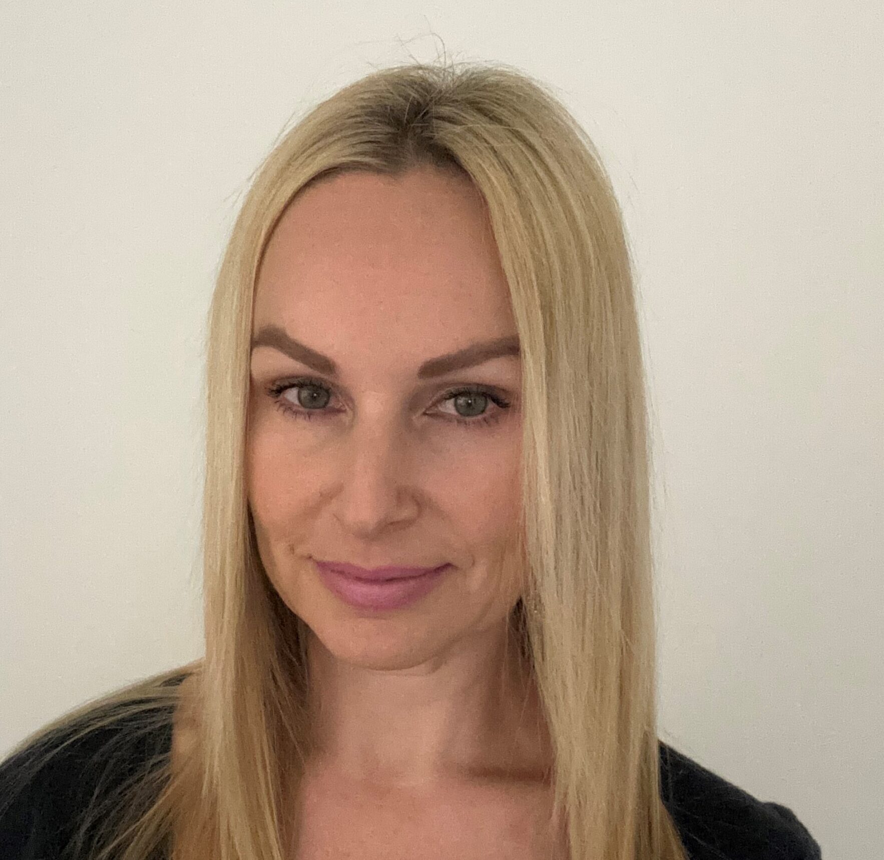 a photo of Claire smiling to camera