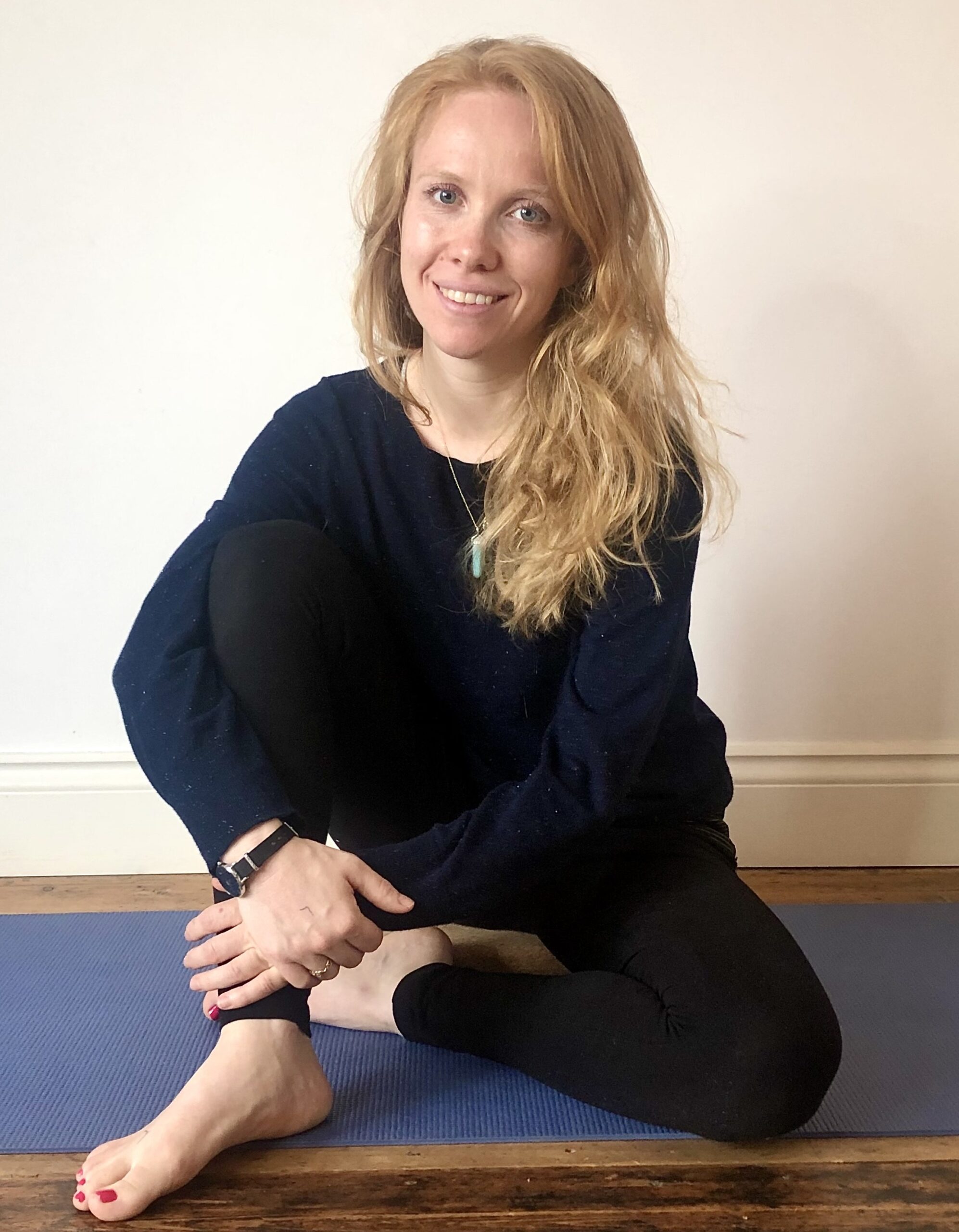 A photo of a woman sitting down